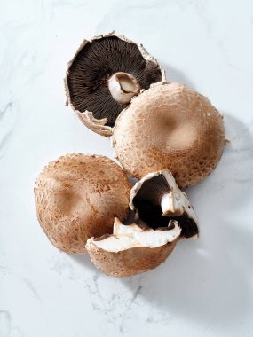 Top view with portobello mushrooms on marble tabletop
