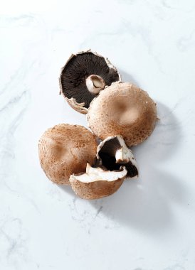 Top view with portobello mushrooms on marble tabletop