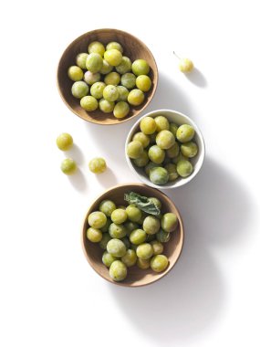 Greemgage plums top view on white background