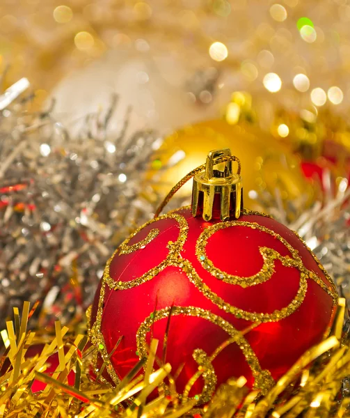 Red Xmas ball with other decorations — Stock Photo, Image