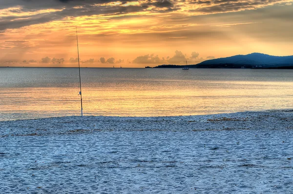 Рибальський стрижень на заході сонця — стокове фото