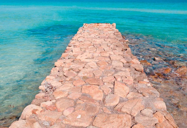 Pier made with stone in Brandinchi — Stock Photo, Image