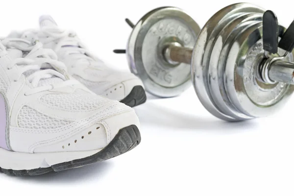 Shoes and dumbbell — Stock Photo, Image