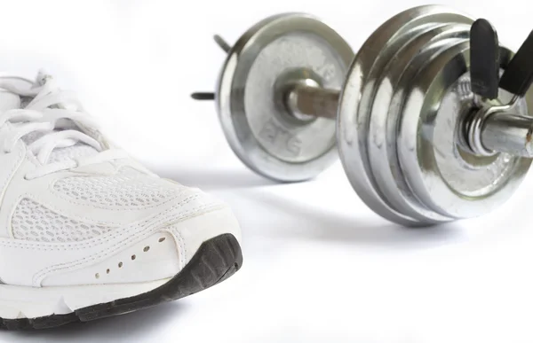 Shoe and dumbbell — Stock Photo, Image