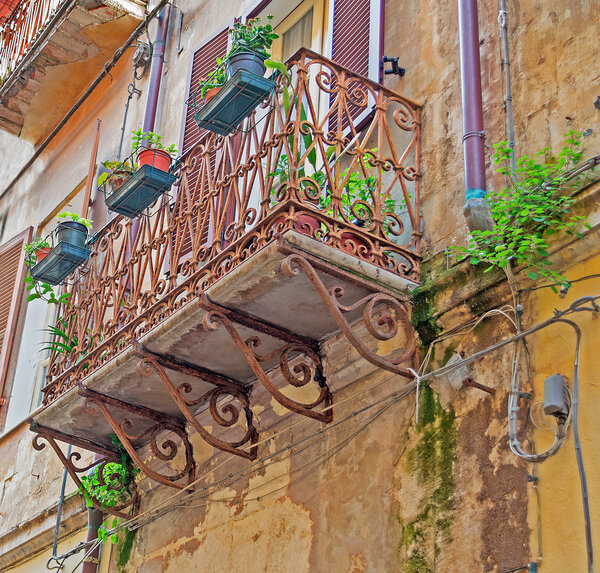 Old balcony seen from below in Sassari old town