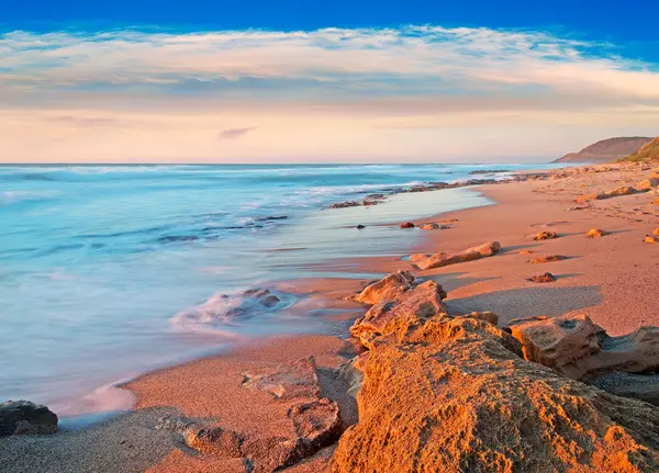 Rocky shore at dusk — Stock Photo, Image