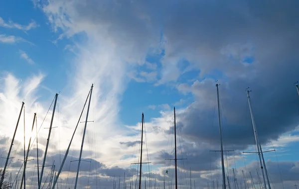 Masts under clouds — Stock Photo, Image