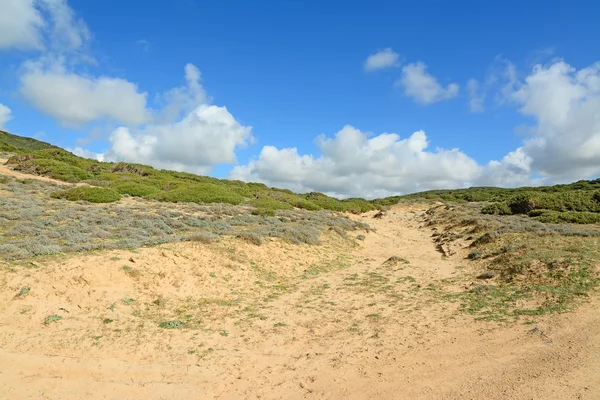 Clouds over a green hill — Stock Photo, Image