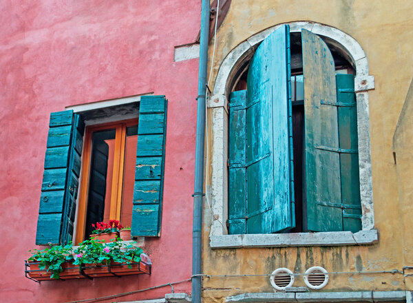 Grunge windows in a colorful wall