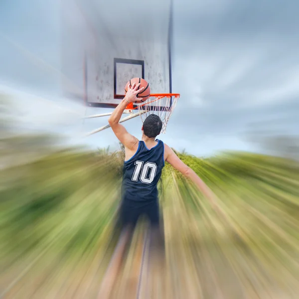 Dunking in a blurred court — Stock Photo, Image