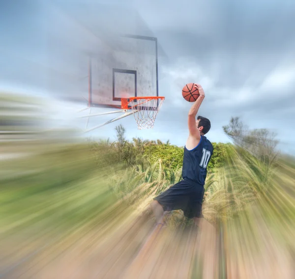 Dunking in a blurred playground — Stok Foto