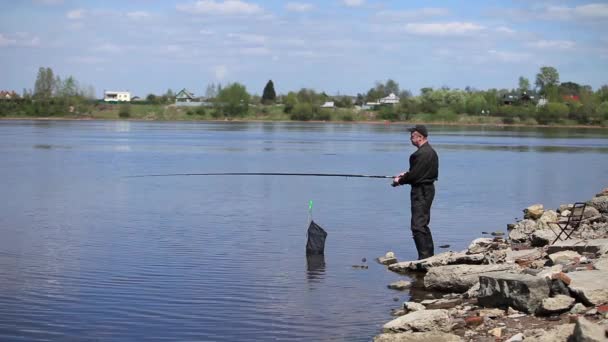 Fishing from the shore — Stock Video