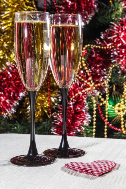 Two champagne glasses ready to bring in the New Year. Romantic theme