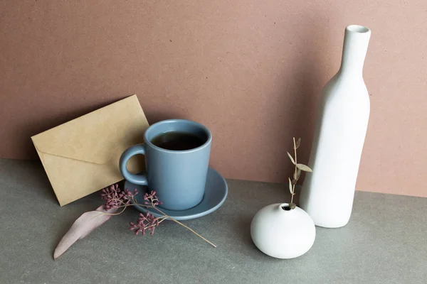 Still Life Coffee Cup Envelope Ceramic Vase Dry Plant Gray — стоковое фото