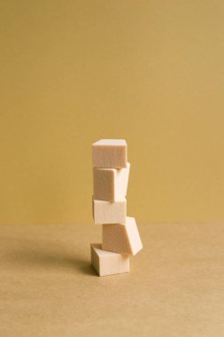 Stack of makeup sponge on brown table background
