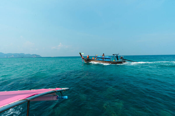 Travel on a long-tail boat in the sea in Krabi