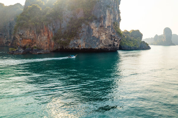 Sea views and rocky islands with a long-tail boat.form above in krabi 