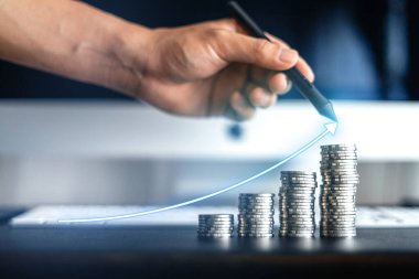 Silver coins stacked up on the desk,money growth