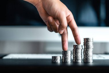 Silver coins stacked up on the desk,money growth