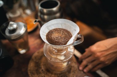 Closeup of hands barista make coffee,Drip coffee