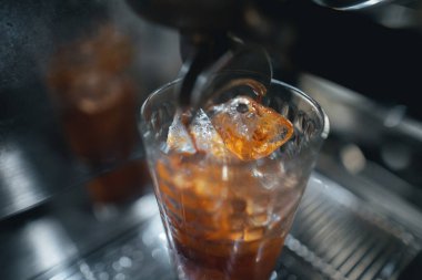 Closeup of hands barista make coffee,coffee from machine