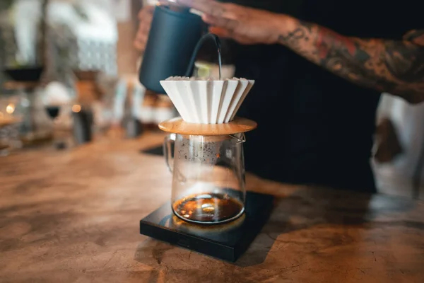 Closeup of hands barista make coffee,Drip coffee