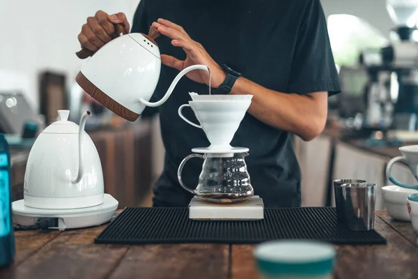 Close up of hand brewing coffee