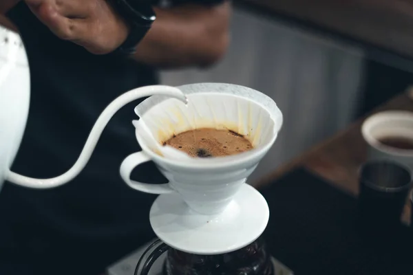 Close up of hand brewing coffee