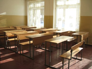 empty classroom with desks clipart