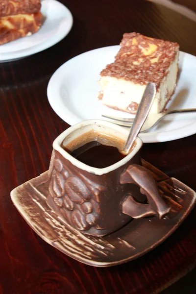 Cup of coffee and portion of cake — Stock Photo, Image