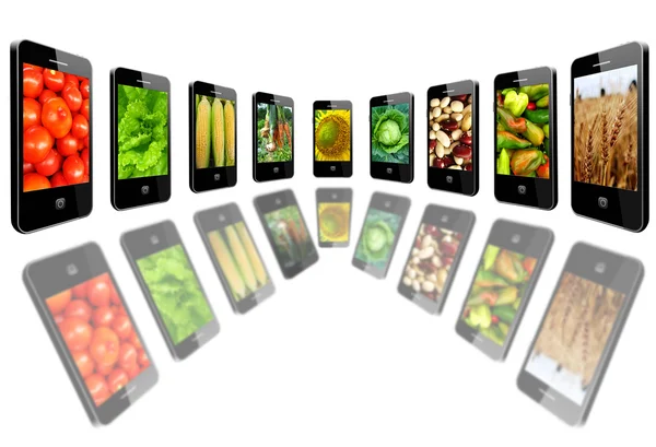 Farklı sebze resimleri ile cep telefonları — Stok fotoğraf