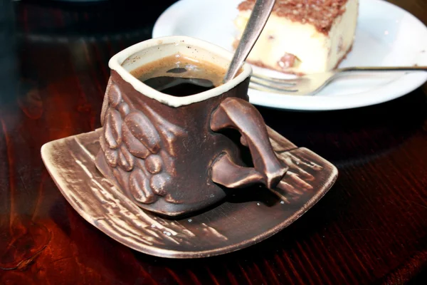 Cup of coffee and portion of cake — Stock Photo, Image