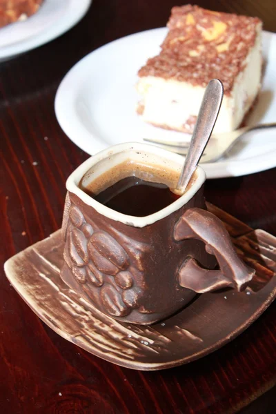 Cup of coffee and portion of cake — Stock Photo, Image