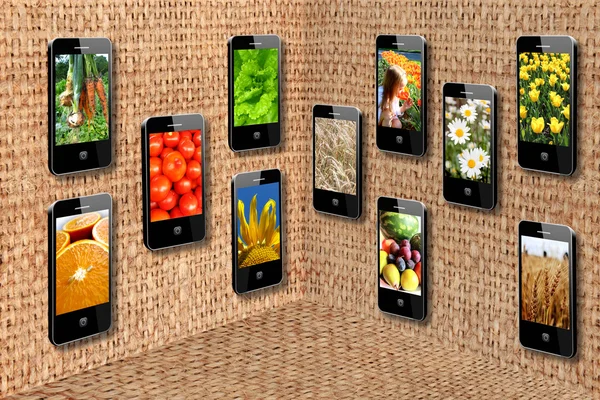 Мобильные телефоны в трехмерной плоскости — стоковое фото