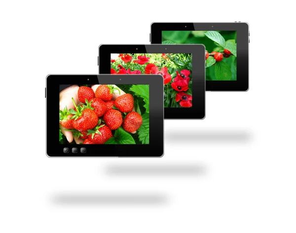 Some black tablets with motley pictures — Stock Photo, Image