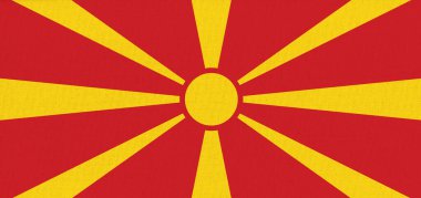 Kuzey Makedonya bayrağı. Kuzey Makedonya devlet sembolü. Kumaş yüzeyinde bayrak var. Kumaş dokusu. Kuzey Makedonya devlet sembolü. Ulusal sembol. Kuzey Makedonlar Cumhuriyeti