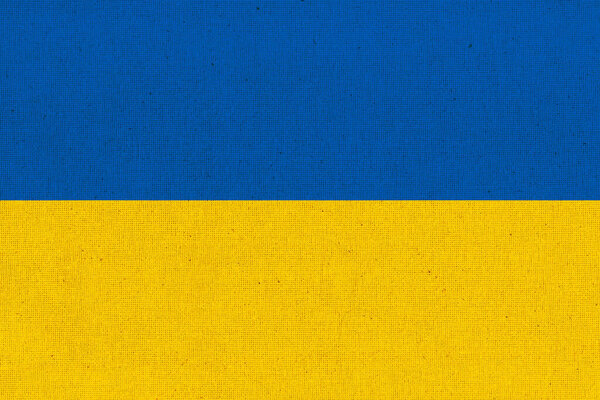 Flag of Ukraine. Ukrainian flag on fabric surface. Fabric texture. National symbol of Ukraine on patterned background. Republic of Turkey