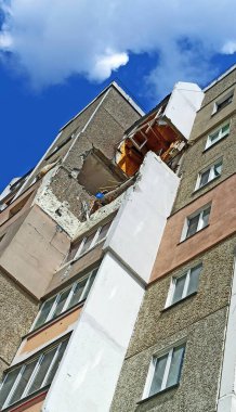 Chernihiv - Ukraine. 18 March 2022: Destruction in wall of a multi-storey building after being hit by artillery shell multi-storey building in Chernihiv where shell hit. dilapidated apartment building during Russo-Ukrainian War