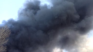 Smoke from fire on outskirts of the city after an air strike by Russian aircraft on the city. Horrors of war in Ukraine. Black smoke against sky. Fire during the war. Disaster