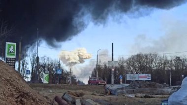 Chernihiv - Ukraine. 08 March 2022: Shelling of the Ukrainian city by Russian troops. War in Ukraine. Horrors of war in Ukraine. Black and white smoke raising above city. Fire during the war