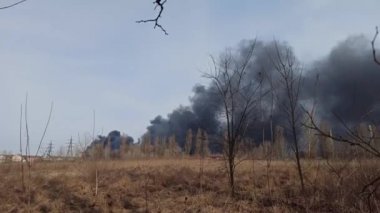Smoke from fire on outskirts of the city after an air strike by Russian aircraft on the city of Chernihiv. Horrors of war in Ukraine. Chernihiv is hero city. Fire during the war