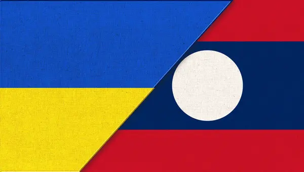 우크라이나 국기와 라오스 우크라이나와 라오스의 아시아 국가의 표면에 있습니다 우크라이나와 — 스톡 사진