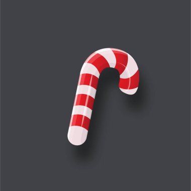 Gri arka planda gölgesi olan Noel şekeri kamışı. Xmas soyulmuş çizgi film lolipopu. Şeker kamışı