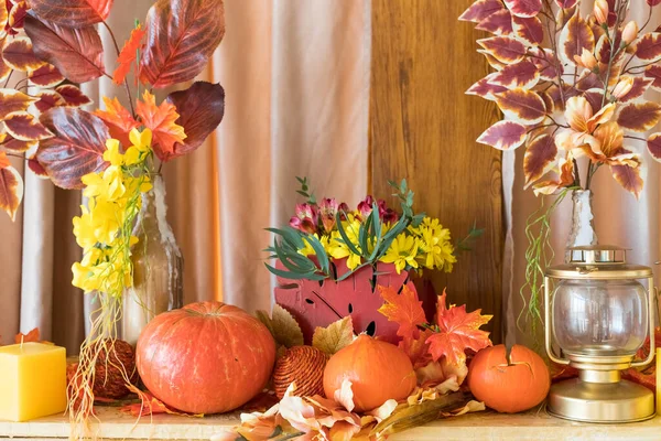 Autumn composition. Pumpkins, candles and dried flowers. Autumn holidays, fall, thanksgiving,halloween concept. cozy home still life. Dry flowers in a vase.Concept of rich harvest and festive mood. — Stock Photo, Image
