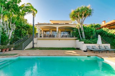 a image from the pool of a costa del sol villa against blue skies 