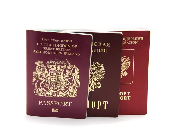 Drie verschillende passports geïsoleerd op wit Stockafbeelding