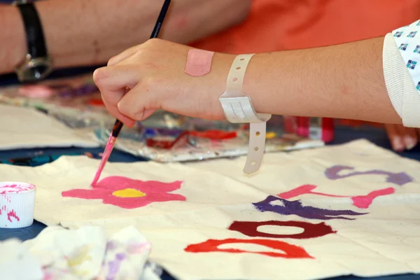 Child painting in paediatrics Stock Image