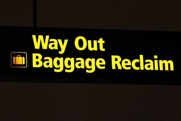 Выезд Знак возврата багажа — стоковое фото