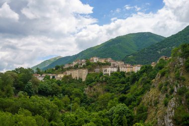 Mountain landscape along the road of Gole del Sagittario, famous canyon in Abruzzo, Italy, L Aquila province. View of Villalago, old village