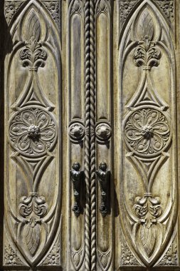 Exterior of historic buildings of Feltre, Belluno province, Veneto, Italy. A wooden door